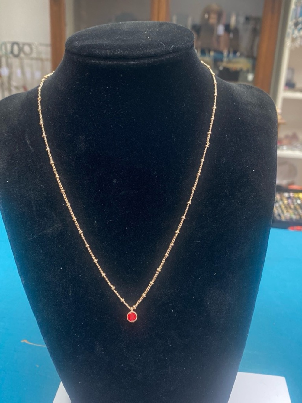 Delicate Gold tone Chain Necklace with Red Pendant
